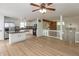 Kitchen & living area featuring new flooring, stainless steel appliances, and white cabinets at 4291 Caledonia Way, Indianapolis, IN 46254
