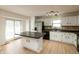 Modern kitchen featuring stainless steel appliances, white cabinets, and granite countertops at 4291 Caledonia Way, Indianapolis, IN 46254