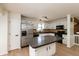 Bright eat-in kitchen featuring stainless steel appliances, white cabinets, and a center island at 4291 Caledonia Way, Indianapolis, IN 46254
