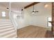 Bright and open living space featuring new floors, staircase, and view to the second floor at 4291 Caledonia Way, Indianapolis, IN 46254