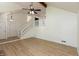 Spacious living room featuring new floors, staircase, and plenty of natural light at 4291 Caledonia Way, Indianapolis, IN 46254