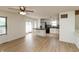 Living and dining area features hardwood floors and is open to the modern kitchen at 4291 Caledonia Way, Indianapolis, IN 46254