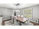 Traditional dining room with a wood table and views of the front yard at 4431 Cranbrook Dr, Indianapolis, IN 46250