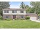 Charming brick and siding home with a well-manicured lawn and beautiful landscaping at 4431 Cranbrook Dr, Indianapolis, IN 46250