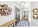 Inviting foyer with hardwood floors and stylish decor, leading to the dining room at 4431 Cranbrook Dr, Indianapolis, IN 46250