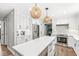Modern kitchen with stainless steel appliances, an island with a quartz countertop, and pendant lighting at 4431 Cranbrook Dr, Indianapolis, IN 46250