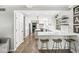 Open concept kitchen with white cabinets, quartz countertops, a large island, and stainless steel appliances at 4431 Cranbrook Dr, Indianapolis, IN 46250