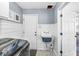 Functional laundry room with modern appliances, wash sink, and easy access to the exterior, great for convenience at 4431 Cranbrook Dr, Indianapolis, IN 46250