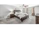 Comfortable main bedroom with ceiling fan, neutral carpet, and lots of space at 4431 Cranbrook Dr, Indianapolis, IN 46250