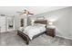 Spacious main bedroom with carpeted floors and ceiling fan at 4431 Cranbrook Dr, Indianapolis, IN 46250