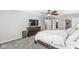 Well lit main bedroom features large dresser, ceiling fan, and carpet at 4431 Cranbrook Dr, Indianapolis, IN 46250