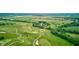 Lush green golf course fairways and trees create an appealing aerial landscape at 4535 N Us Hwy 52, Thorntown, IN 46071