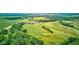 Aerial perspective showcases the rolling hills of the verdant golf course and mature trees at 4535 N Us Hwy 52, Thorntown, IN 46071