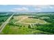 Scenic aerial view of green space, walking paths and a pond situated next to a highway at 4535 N Us Hwy 52, Thorntown, IN 46071