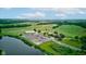 Aerial view highlighting the lush golf course with pond, parking lot and surrounding landscape at 4535 N Us Hwy 52, Thorntown, IN 46071