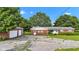 Charming single-story brick home with a detached garage and a spacious driveway at 4535 N Us Hwy 52, Thorntown, IN 46071