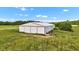 Exterior of a white metal building with red trim, offering ample storage or workspace at 4535 N Us Hwy 52, Thorntown, IN 46071