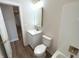 Updated bathroom featuring a vanity with a modern, gold-trimmed mirror and fixtures at 4726 Deacon Ln, Indianapolis, IN 46237