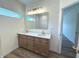 Modern bathroom with dual sinks, sleek fixtures, and a glass-enclosed shower at 4726 Deacon Ln, Indianapolis, IN 46237