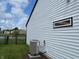 Home exterior with a side view showing the backyard, pond, and manicured lawn at 4726 Deacon Ln, Indianapolis, IN 46237