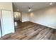 Spacious living room featuring hardwood floors and a view into the front entry at 4726 Deacon Ln, Indianapolis, IN 46237
