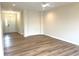 Bright living room with hardwood floors and modern fixtures, offering a warm and inviting space at 4726 Deacon Ln, Indianapolis, IN 46237