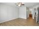This bedroom boasts hardwood floors and convenient access to an adjacent bathroom, offering practical living at 5003 Opal Ridge Ln # 101, Indianapolis, IN 46237