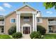 Inviting exterior featuring a well-maintained facade, beautiful landscaping, and covered entrance at 5003 Opal Ridge Ln # 101, Indianapolis, IN 46237