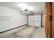 A spacious garage featuring a new garage door and additional space for parking and storage at 5003 Opal Ridge Ln # 101, Indianapolis, IN 46237