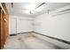 The garage offers ample storage space with exposed framing, shelves, and lighting at 5003 Opal Ridge Ln # 101, Indianapolis, IN 46237