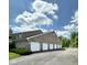 The exterior features a large parking lot with multiple garages, providing ample space for vehicles and storage at 5003 Opal Ridge Ln # 101, Indianapolis, IN 46237