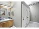 Well-maintained community restroom with a sink and mirror plus multiple private toilet stalls at 5003 Opal Ridge Ln # 101, Indianapolis, IN 46237