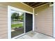 View of the backyard from the condo's sliding door, offering a seamless transition between indoor and outdoor living spaces at 5003 Opal Ridge Ln # 101, Indianapolis, IN 46237