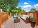 Cozy wooden deck with comfortable patio furniture, ideal for relaxing and enjoying the beautiful outdoor scenery at 528 W Mechanic St, Shelbyville, IN 46176