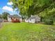 Expansive backyard featuring a wooden deck and a detached garage, offering plenty of space and privacy at 528 W Mechanic St, Shelbyville, IN 46176