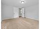 This bedroom features neutral carpeting and ample closet space, providing a blank canvas for personalization at 528 W Mechanic St, Shelbyville, IN 46176