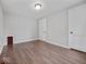 This bedroom features hardwood floors, with a closet door, offering a clean and versatile space at 528 W Mechanic St, Shelbyville, IN 46176