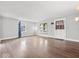 Bright living room featuring hardwood floors, large windows, and neutral decor, offering a welcoming space at 528 W Mechanic St, Shelbyville, IN 46176