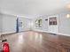 Spacious living room with hardwood floors, natural light, and neutral walls creating a comfortable atmosphere at 528 W Mechanic St, Shelbyville, IN 46176