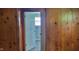The interior has wood paneling and doorways leading to other rooms in the house at 5344 Fletcher Ave, Indianapolis, IN 46219