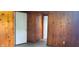 The interior features wood paneling with multiple doorways leading to other rooms in the house at 5344 Fletcher Ave, Indianapolis, IN 46219