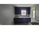 Kitchen with dark cabinets and a stainless steel sink at 5344 Fletcher Ave, Indianapolis, IN 46219