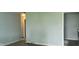 Empty living room with light-blue walls and electrical outlets at 5344 Fletcher Ave, Indianapolis, IN 46219