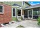 Backyard patio area featuring outdoor seating and access to a screened-in porch, perfect for outdoor gatherings at 58 Penn Pl, Zionsville, IN 46077