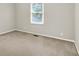 Bedroom featuring neutral wall paint, carpeted floors, and a window offering ample natural light at 58 Penn Pl, Zionsville, IN 46077