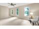 Large bedroom with lots of natural light, carpeted floors, ceiling fan and a chair at 58 Penn Pl, Zionsville, IN 46077