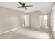 Open bedroom with carpet, ceiling fan, multiple doorways, neutral walls, and good natural light at 58 Penn Pl, Zionsville, IN 46077