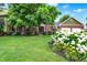 Beautiful exterior of a two-story home with a well-maintained lawn and colorful landscaping at 58 Penn Pl, Zionsville, IN 46077