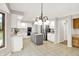 Open concept kitchen with stainless appliances, an island, and plenty of cabinet and countertop space at 58 Penn Pl, Zionsville, IN 46077