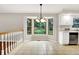Bright eat-in kitchen featuring a large bay window, stainless steel appliances, and tiled flooring at 58 Penn Pl, Zionsville, IN 46077